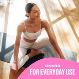 Woman in athletic wear sitting on a yoga mat with text 'LINERS FOR EVERYDAY USE'