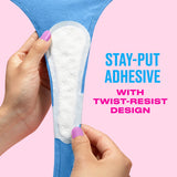 Hand applying Carefree liner to a blue underwear with text 'Stay-put adhesive with twist-resist design'